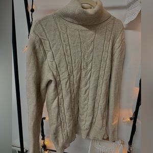 Women’s beige turtleneck knitted sweater